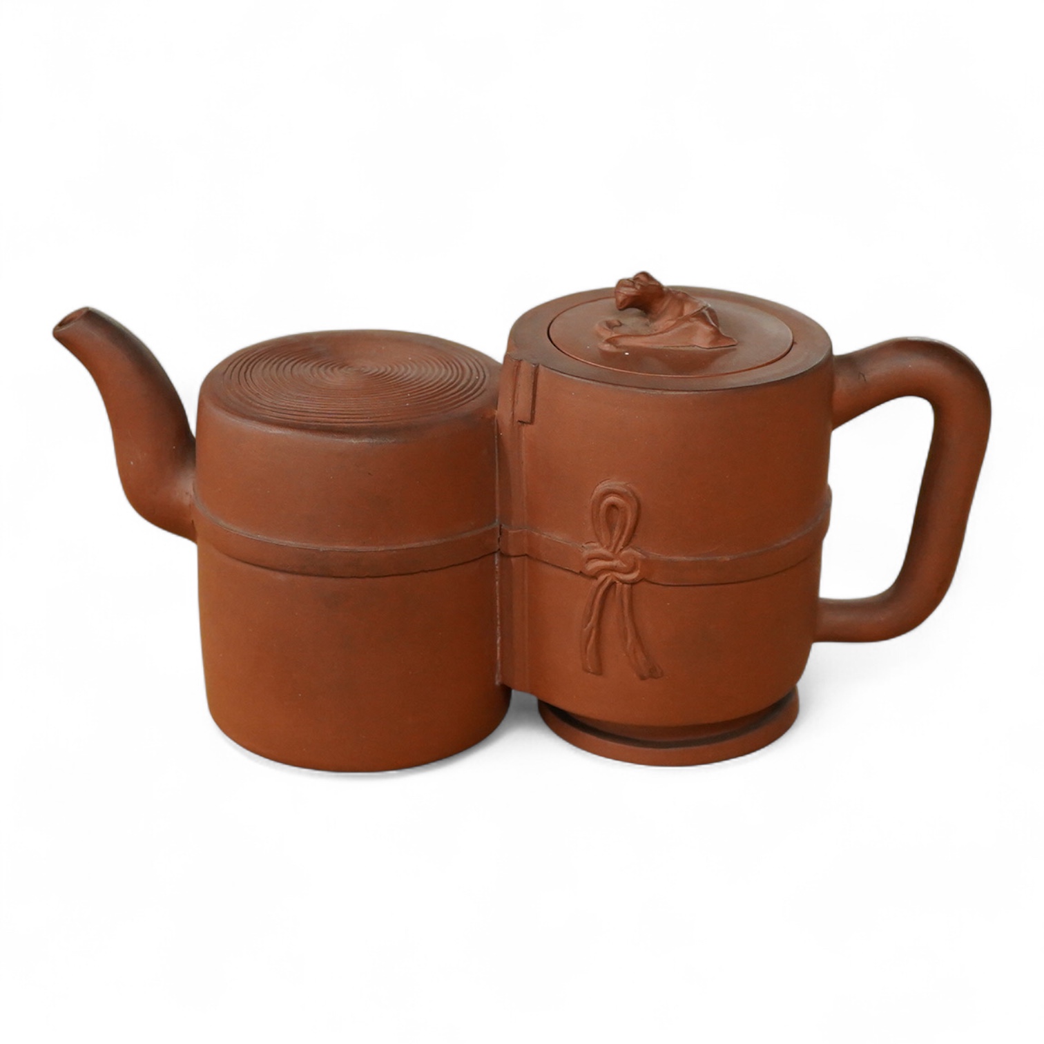 A Chinese Yixing conjoined teapot and cover, 21cm wide